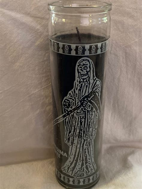 After the candle has fully burned down you can throw away the glass. . Black santa muerte candle